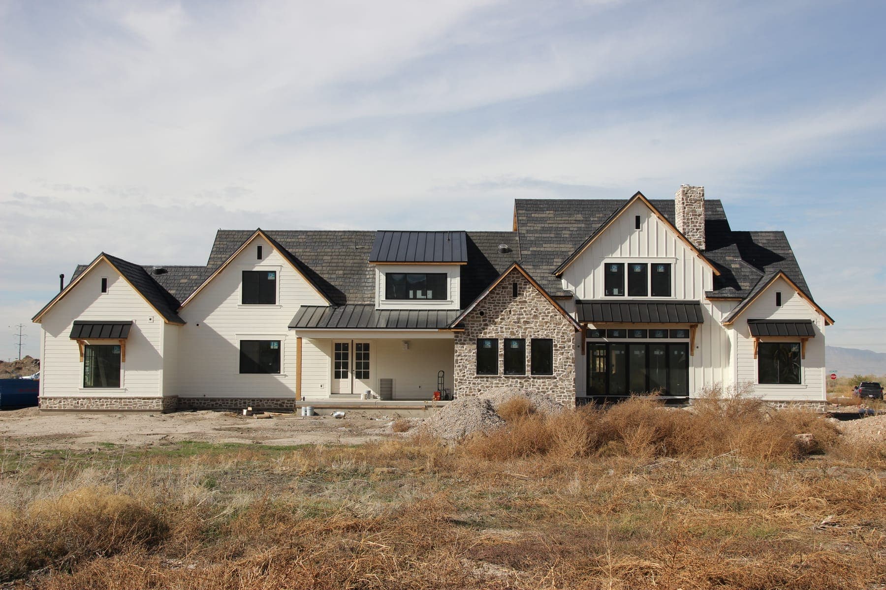 Gray custom home in Utah with a newly replaced Legacy Roofing shingle roof